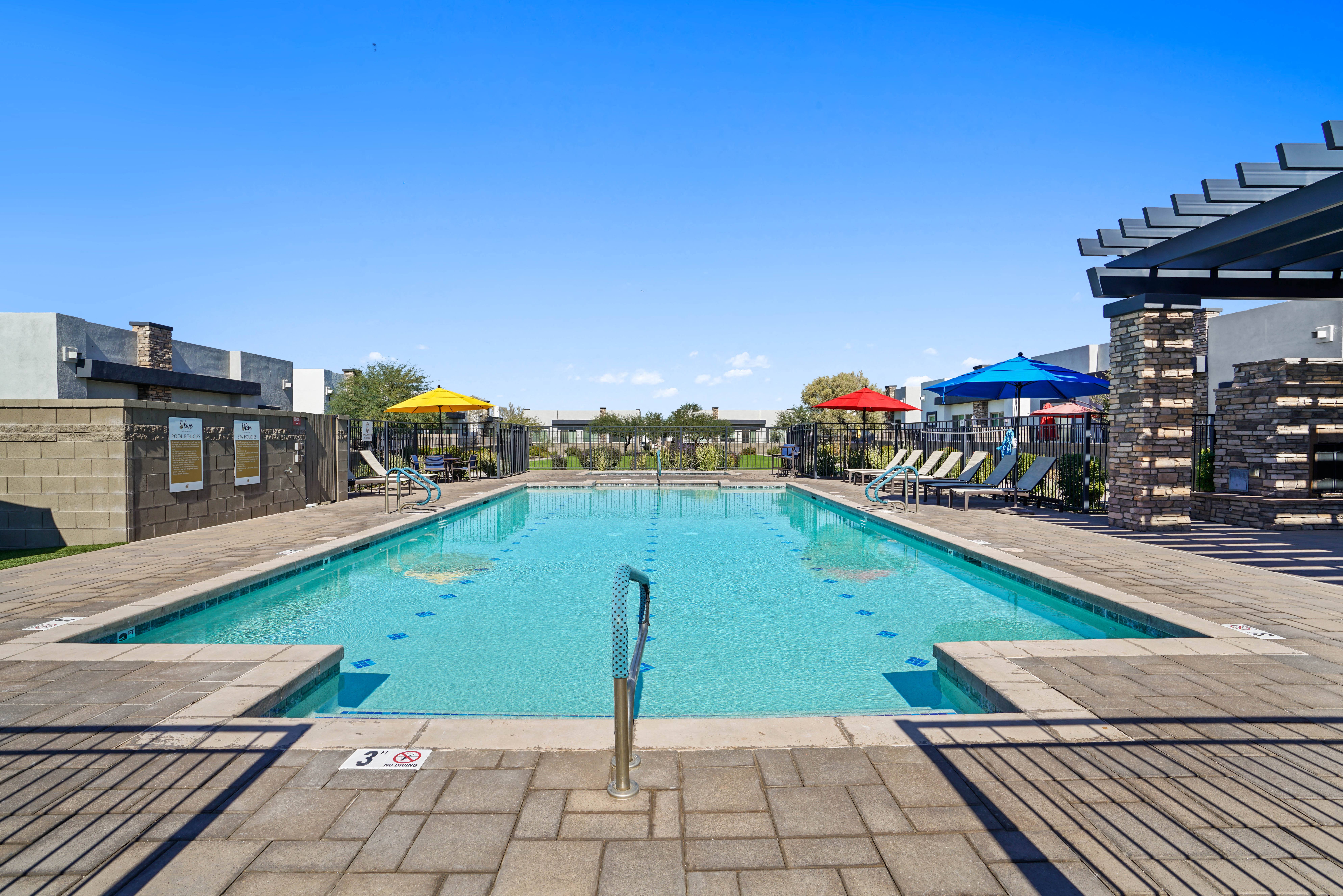 the swimming pool at the resort at glade springs at Olive Queen Creek Apartments, Queen Creek, 85142